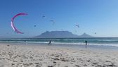 Kites above Kite Beach in Blouberg with Table Mountain behind
