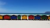 The colourful bathing boxes at Muizenberg in front of the False Bay surf